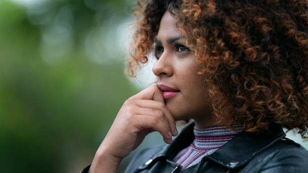 istock Black woman pondering solution to problem. Brazilian girl thinking contemplating solution 1360213056