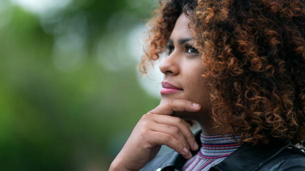 istock Black woman pondering solution to problem. Brazilian girl thinking contemplating solution 1360213066