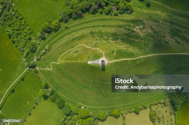 Glastonbury Tor Filmed From Drone On Sunny Day Iconic Monument In The Middle Of The Countryside Stock Photo - Download Image Now
