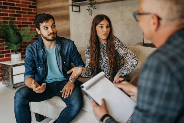Young couple in counseling session with a therapist
