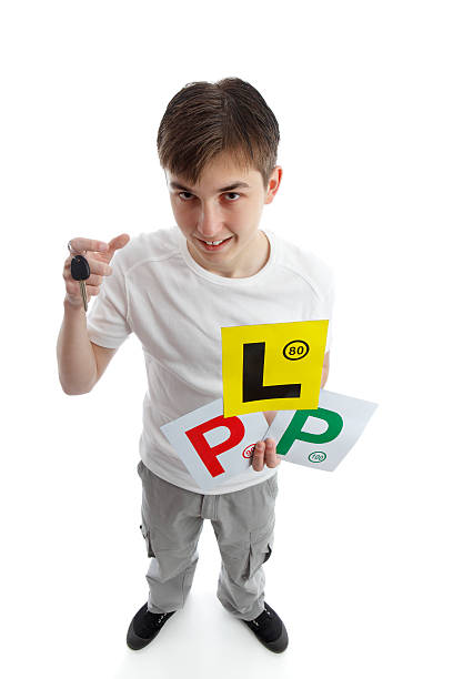 istock Teenager with learner driver licence plates 136021429
