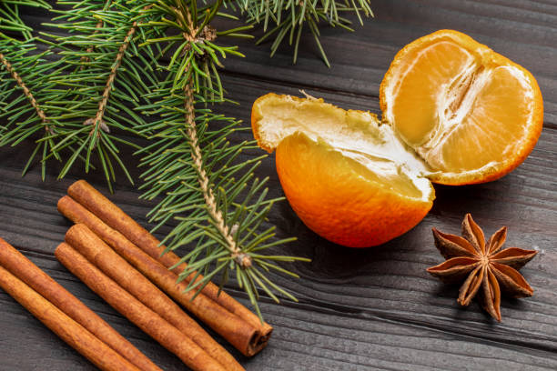 istock Tangerine halves and cinnamon sticks. 1360215771