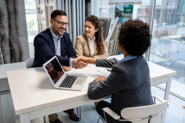 istock Two business people shaking hands after reaching an agreement 1360217042