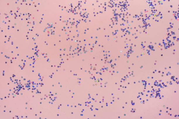istock Pink background with small purple holographic sparkles. 1360217164