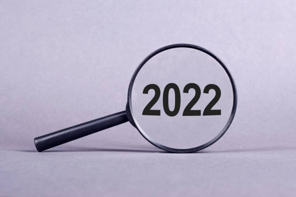istock Text 2022 through magnifying glass on a light grey background 1360218195