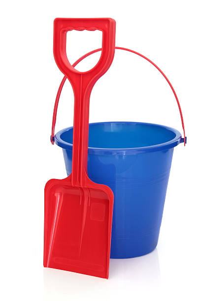 istock Red shovel and a blue pail beach toys on a white background 136022149