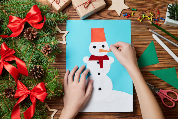 A Christmas greeting card from colored paper made by a child
