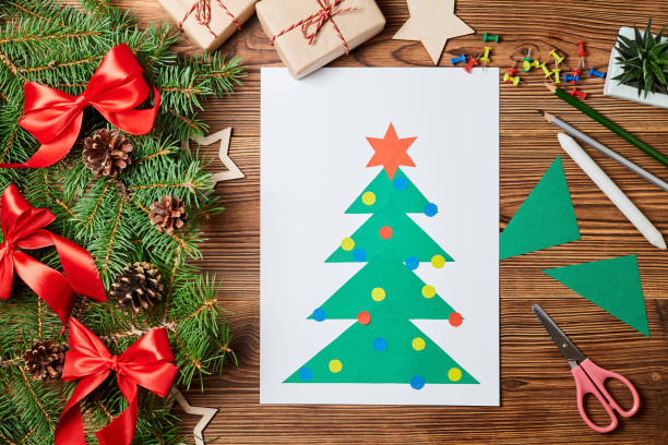 istock A Christmas greeting card from colored paper made by a child 1360222043