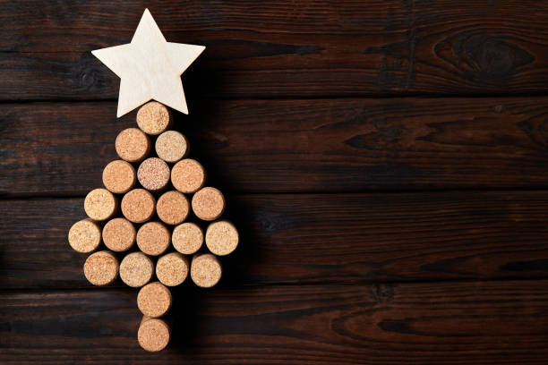 istock Christmas tree from wine corks with a star on top on a wooden background 1360222155