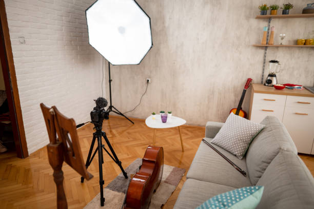 istock Image of a studio apartment with violoncello on the floor beside couch 1360222613
