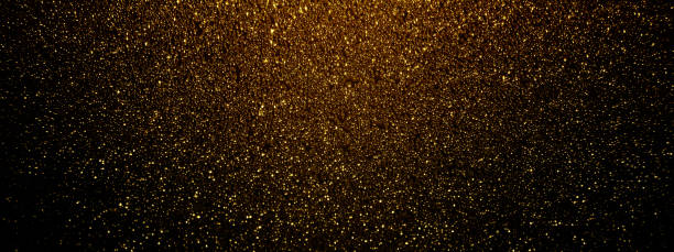 istock Gold and black glitter texture background. Shiny festive banner 1360223303
