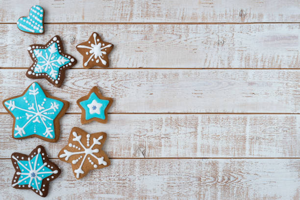 istock Frame made with different Christmas gingerbread cookies on rustic wooden background, top view. Space for text 1360223543