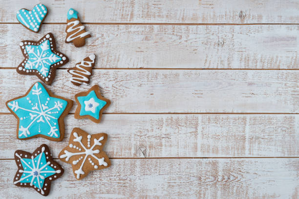 istock Frame made with different Christmas gingerbread cookies on rustic wooden background, top view. Space for text 1360223549