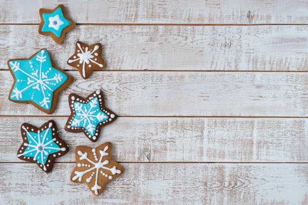 istock Frame made with different Christmas gingerbread cookies on rustic wooden background, top view. Space for text 1360223572