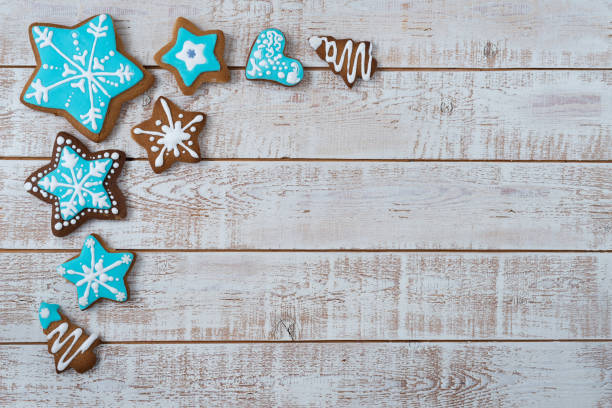 istock Frame made with different Christmas gingerbread cookies on rustic wooden background, top view. Space for text 1360223607