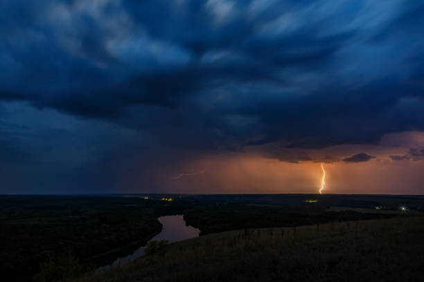 Climate change and bad weather. Thunderstorm and rain on the dark sky.