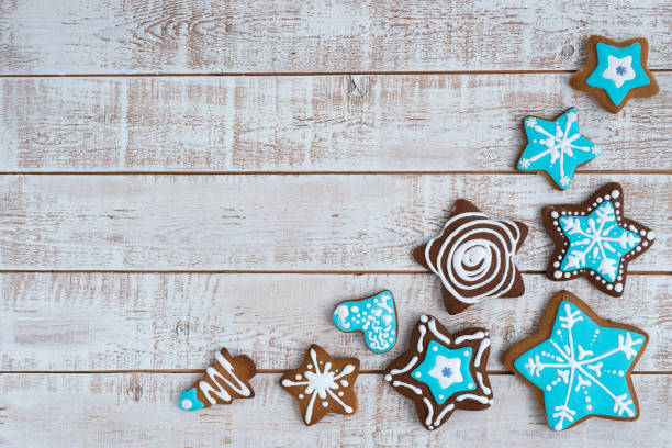 istock Frame made with different Christmas gingerbread cookies on rustic wooden background, top view. Space for text 1360223713