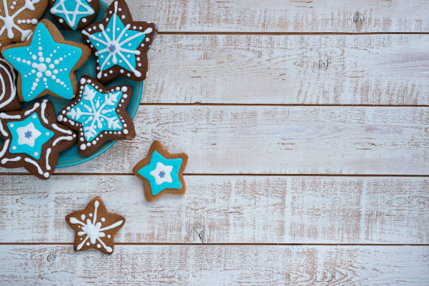 istock Frame made with different Christmas gingerbread cookies on rustic wooden background, top view. Space for text 1360223961