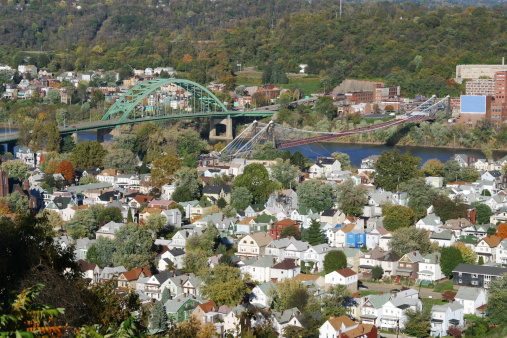 Wheeling, West Virginia. South Island in the foreground with two bridges across the Ohio River. Compressed houses in the foreground and bridges at middle.