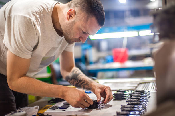 istock Technician making fridge magnet with soft PVC rubber in mold 1360225237