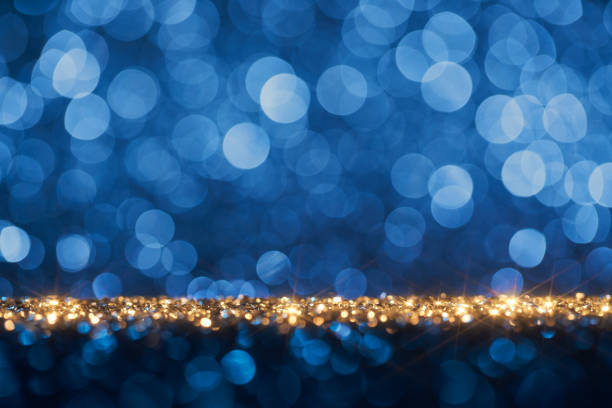 istock Shiny blue holiday background - Star Defocused Gold Bokeh 1360227212
