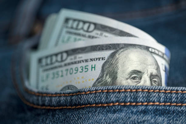 istock Dollar bills in jeans pocket 1360227485