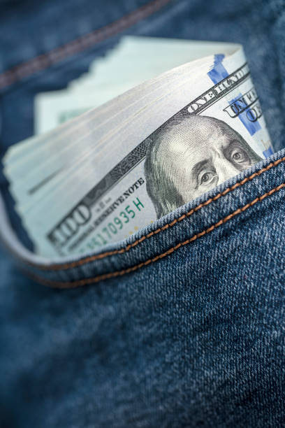 istock Dollar bills in jeans pocket 1360227508