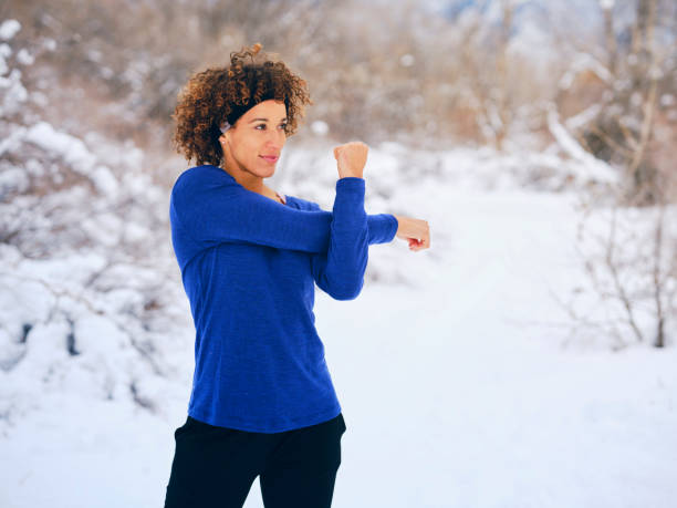 istock A Woman Stretching Before a Winter Run 1360228826