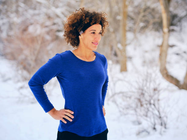 istock A Woman Stretching Before a Winter Run 1360228878