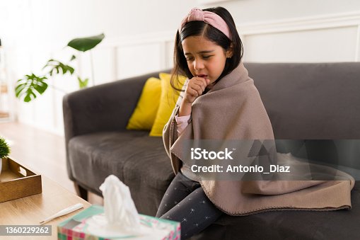 istock Sad child suffering from the flu 1360229262