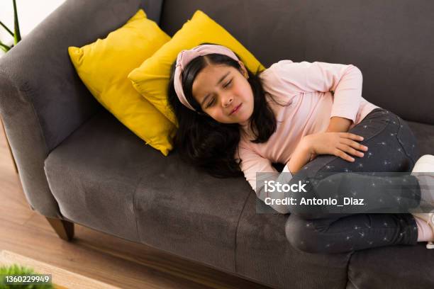 Sad Little Child With A Stomach Virus Stock Photo - Download Image Now - Stomachache, Child, Gastroenteritis