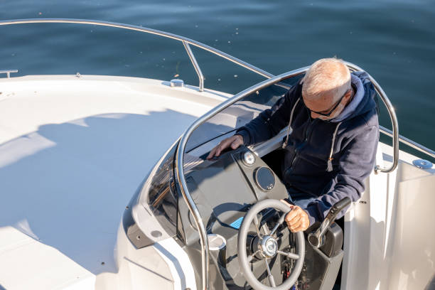 istock Man boating on a sunny day 1360230181
