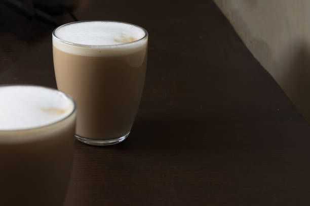 Two glasses of coffee with milk cappuccino or latte stock photo