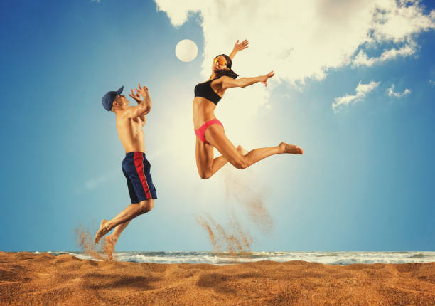 Beach volleyball player in action at sunny day under blue sky. â Matte Image
