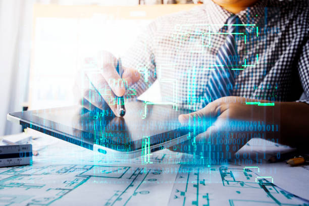 istock engineer people meeting working and pointing at a drawings in office for discussing. Engineering tools and construction concept. 1360235222