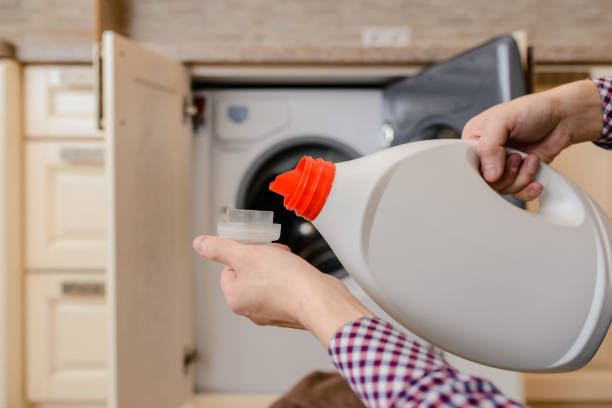 istock Close up of young man hand pouring liquid detergent 1360235500
