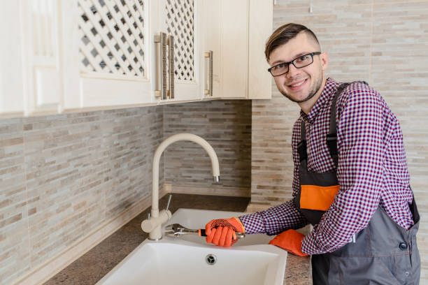 istock installer fixes with wrench the water tap pipe in vintage kitchen 1360236231