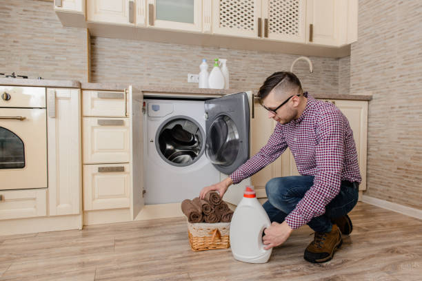 istock Young man prepare for washing towels 1360239340
