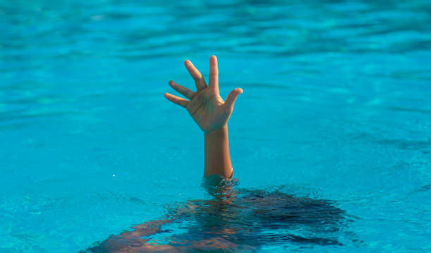 istock The child is drowning in the sea. Selective focus. 1360240038