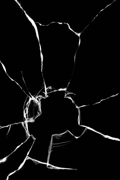 istock Cracked broken glass, texture for design on a black background. 1360243373