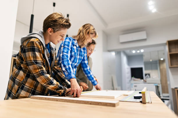 istock Mother and sons making kitchen installation at home 1360244674