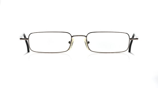 Small reading glasses on white background