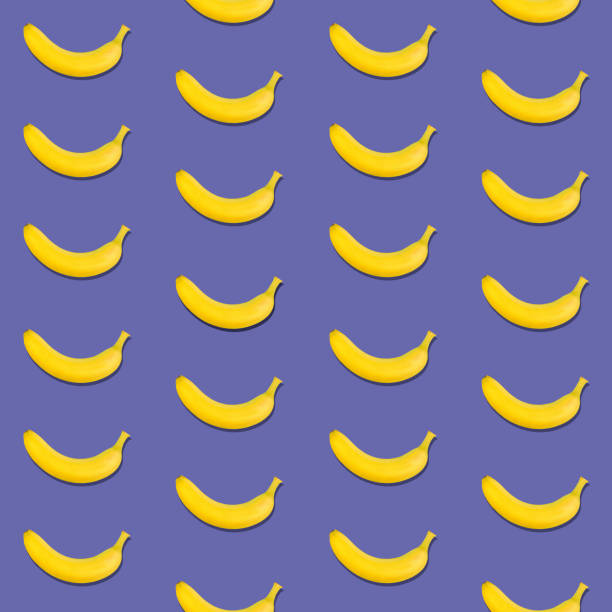 istock Seamless pattern of bananas on purple 1360247315