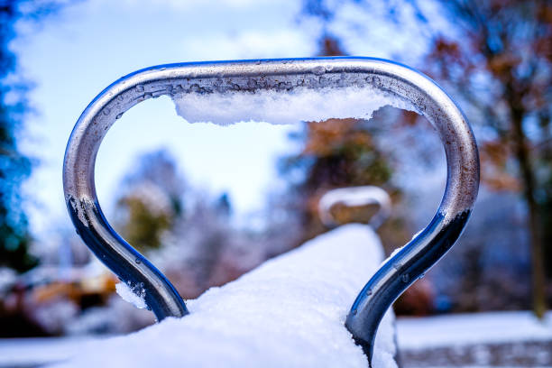 Bicycle handlebars covered with snow.