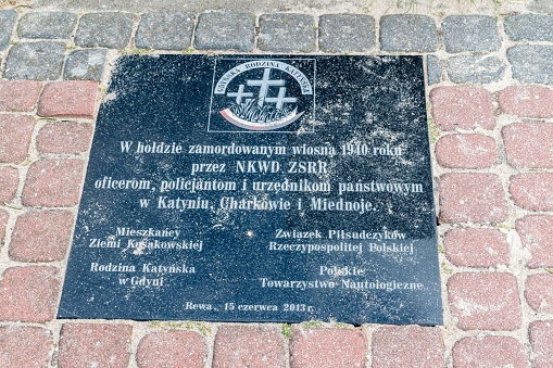 Rewa, Poland - August 21, 2021: Plaque in tribute to those murdered in the spring of 1940 by the NKVD of the USSR.