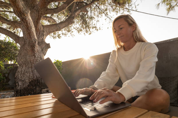 istock Young woman working online on her computer, active morning lifestyle 1360252461