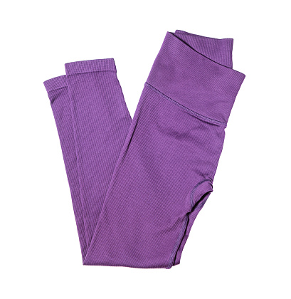 Sports womens purple leggings for sports active training isolated on white background.