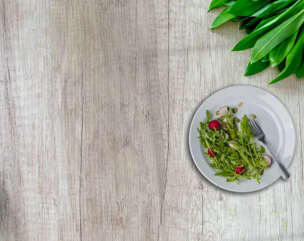 salad plate on wooden table natural concept top view