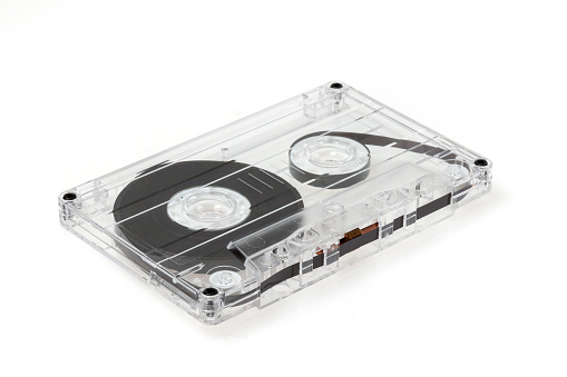 Audio cassette tape on white in plastic case