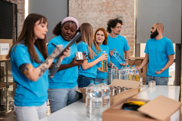 istock Volunteers working in donation center 1360264797